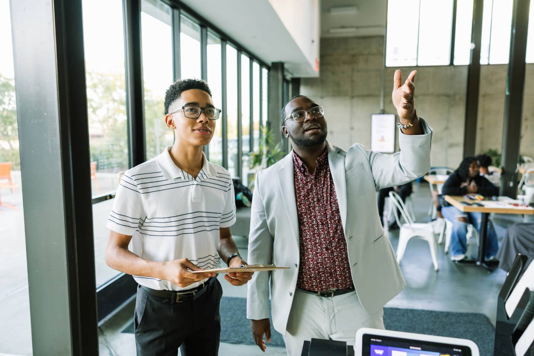 A mentor guiding a young person through their career journey